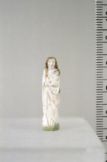 Statuette; enclosed in a rosary pendant. (Front)