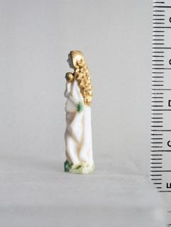 Statuette; enclosed in a rosary pendant. (Side)